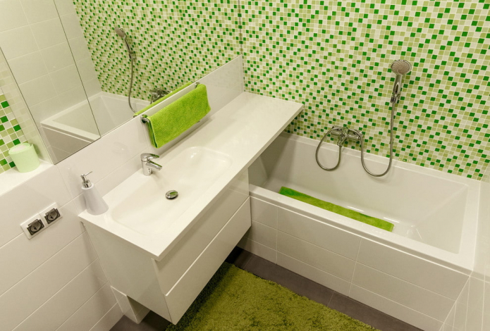 white and green interior of a small bathroom