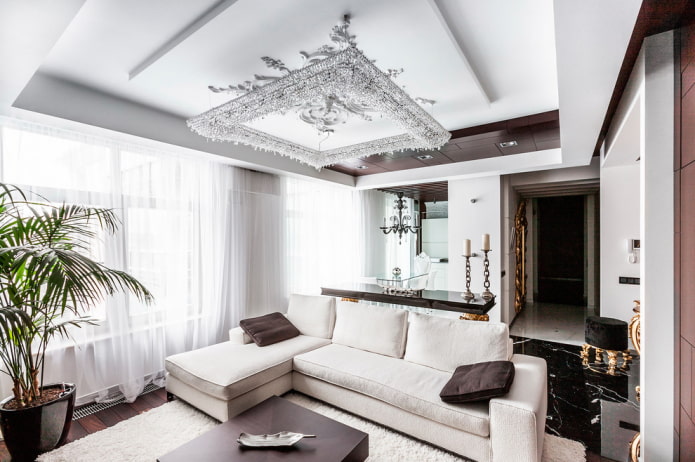 chandelier over the sofa in the living room interior