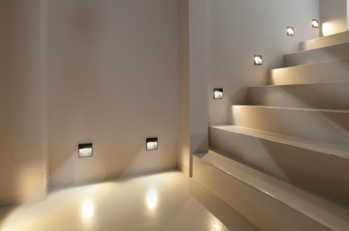 staircase with wall lights in the house