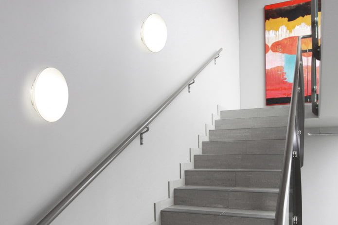 staircase with wall lights in the house