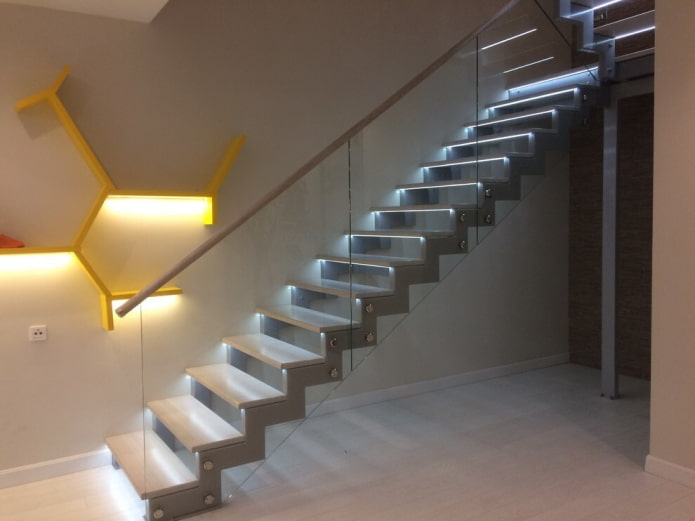illuminated metal staircase in the interior of the house