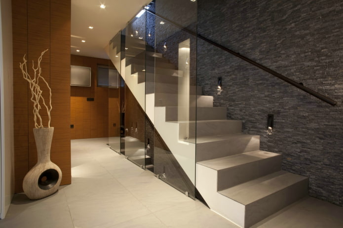 illuminated concrete staircase in the interior of the house