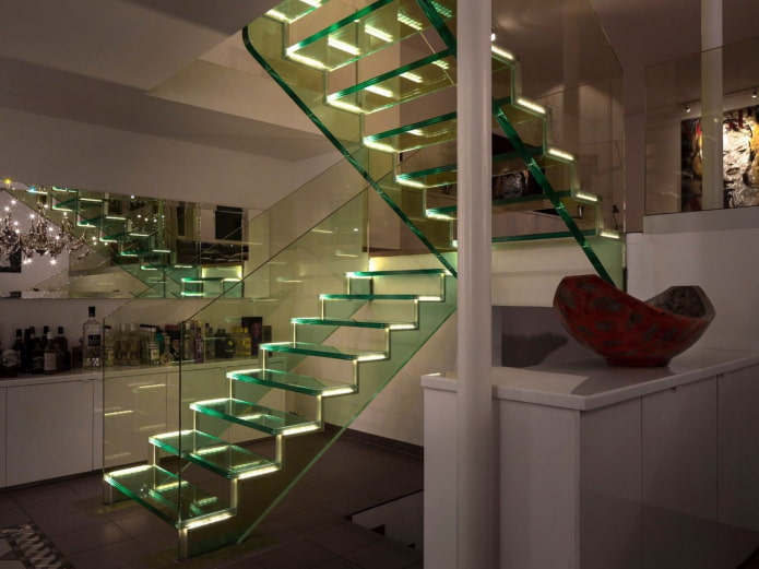 transparent staircase with lighting in the interior of the house