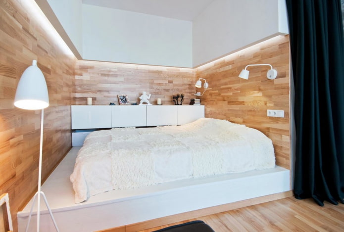 bed on a monolithic podium in the interior