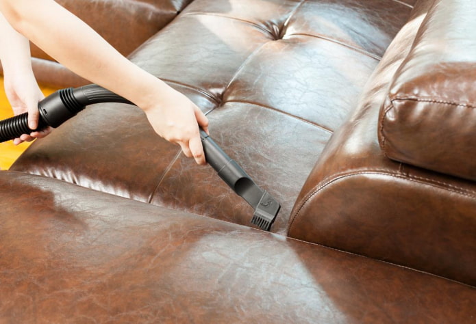 Cleaning the upholstery with a vacuum cleaner