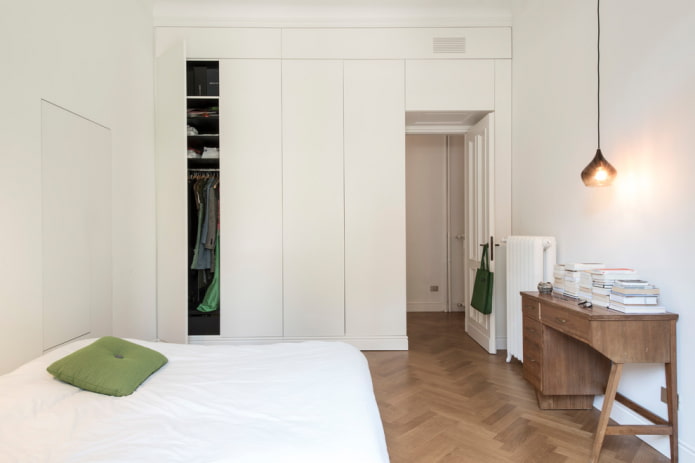 Wardrobe in the bedroom in the color of the walls