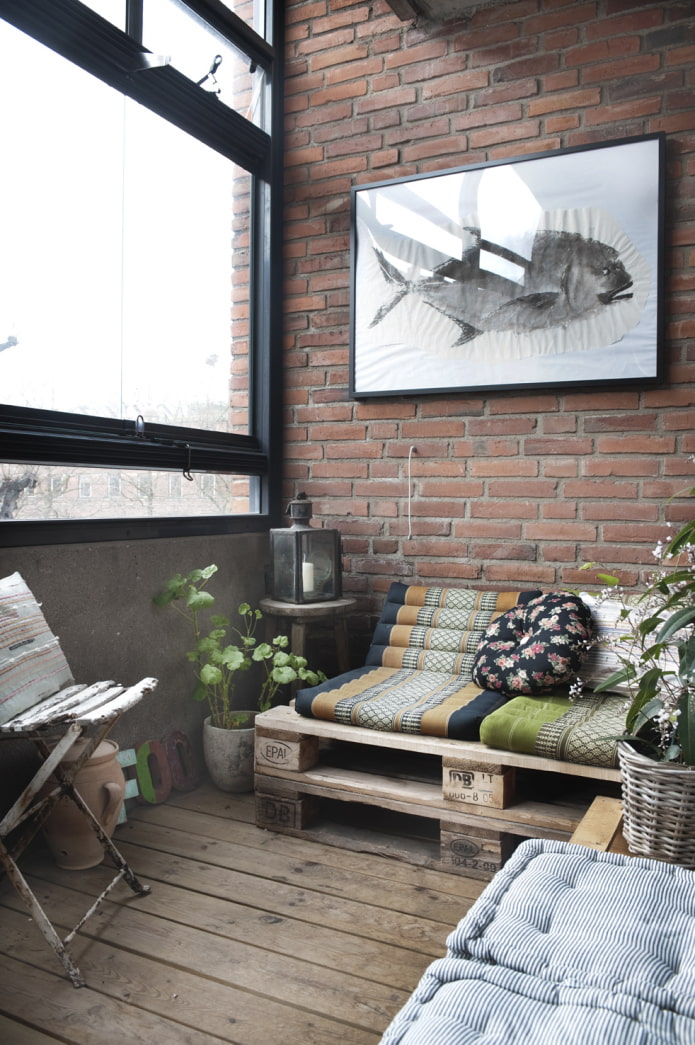 Loggia with loft-style pallet furniture