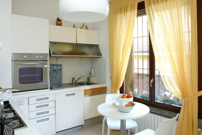 small kitchen with curtains