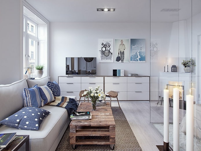 Long chest of drawers in the interior of a white living room