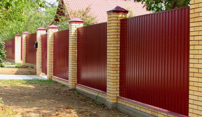 Corrugated fence with brick columns
