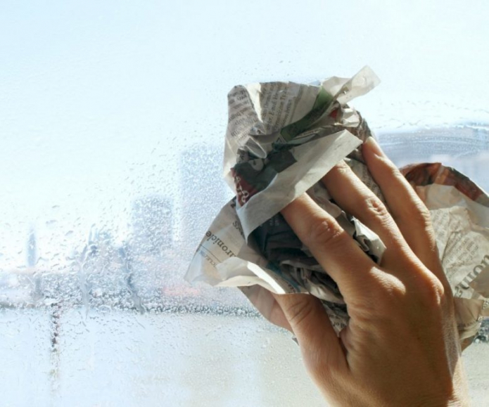 washing windows with newspaper