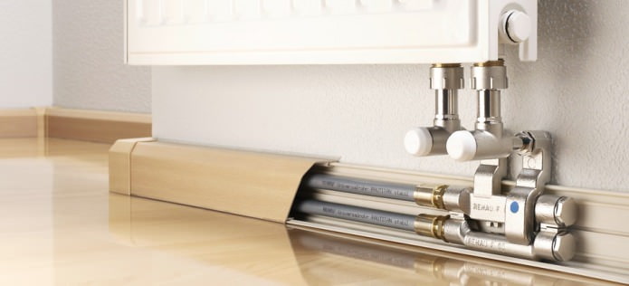 Hide pipes under the baseboard