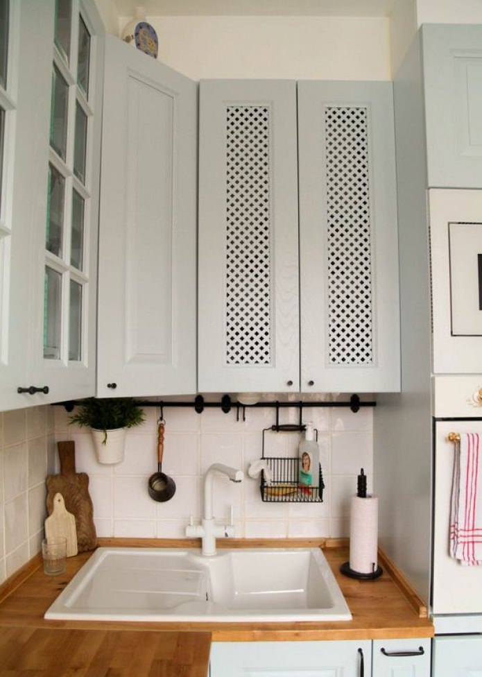 hide pipes in the kitchen cabinet