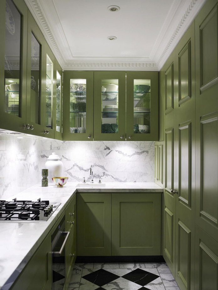 white countertop in green kitchen