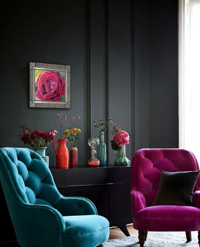 colored armchairs in a dark living room