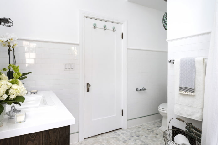white bathroom with door