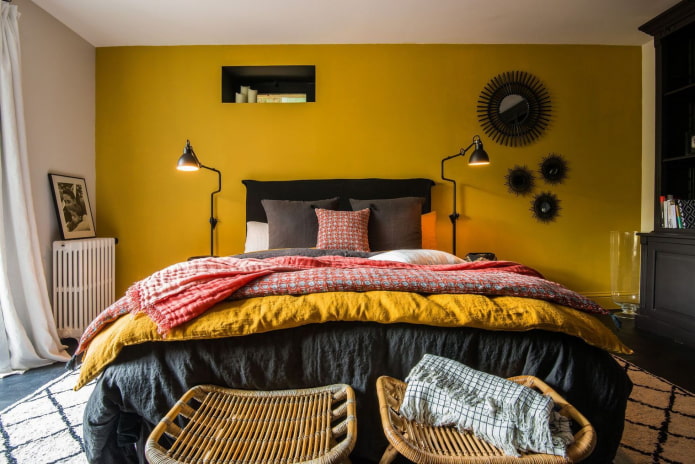 mustard wall behind the bed
