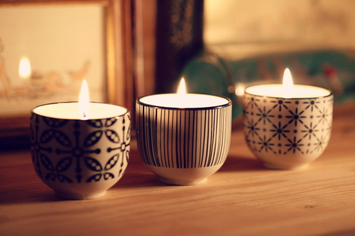 Candles in ceramic candlesticks