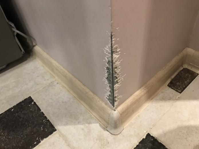 damage to the corner in the hallway