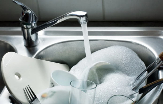 dishes in the sink with water