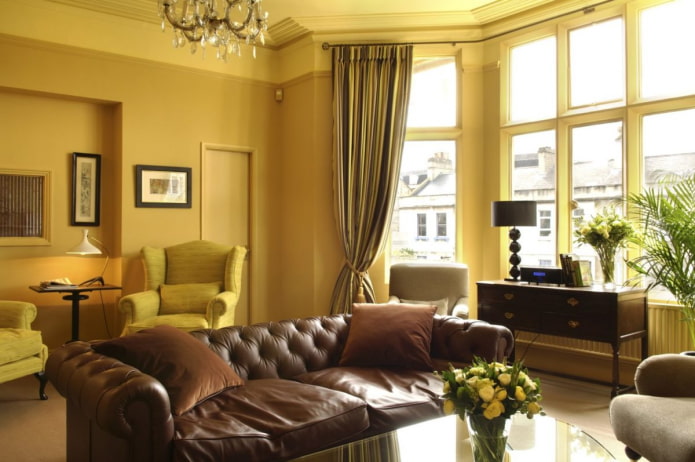 dark yellow living room with brown leather sofa