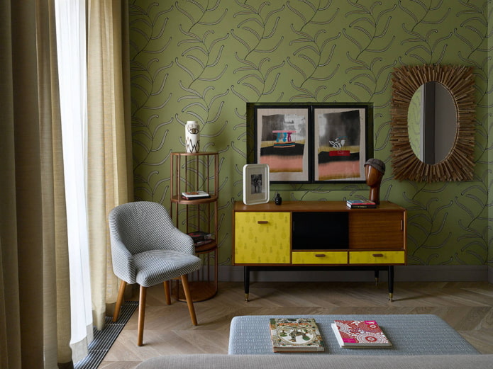 chest of drawers with yellow fronts, standing against a green wall