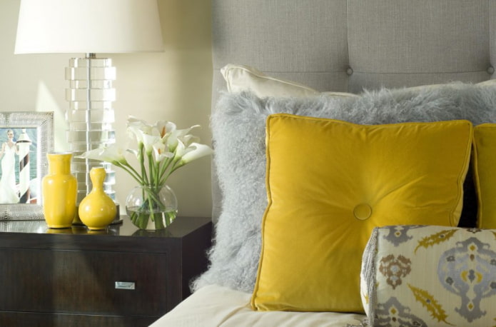 yellow pillows and vases in the bedroom