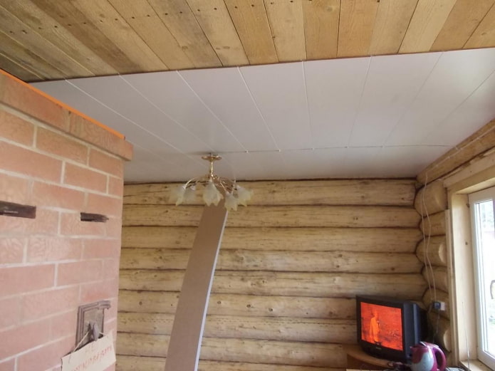 installation of plastic ceiling panels in a wooden cottage