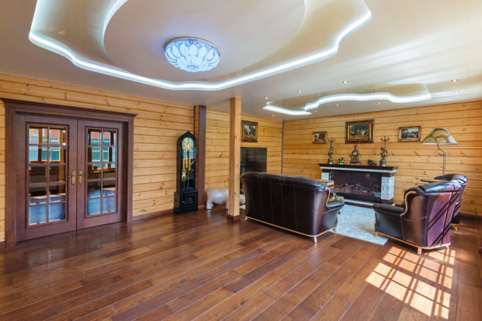figured multi-level ceiling with lighting in a wooden living room