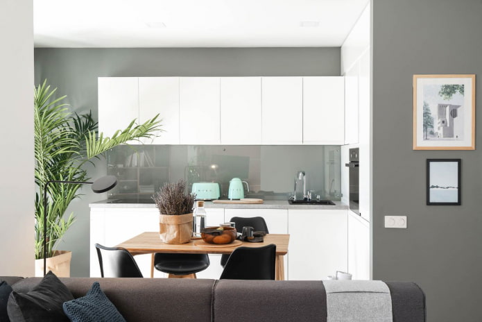 kitchen with gray-green walls and snow-white glossy furniture