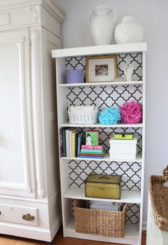 the inner part of the cabinet is stylized with wallpaper with geometry