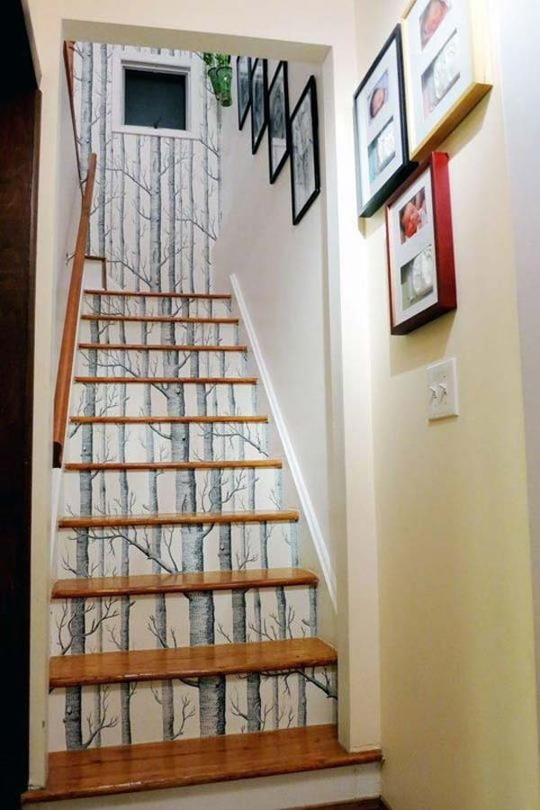 steps of the stairs, covered with wallpaper with a pattern of wood