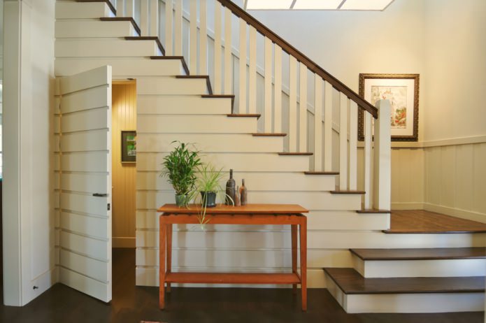 the doors to the pantry merge with the finishing of the stairs