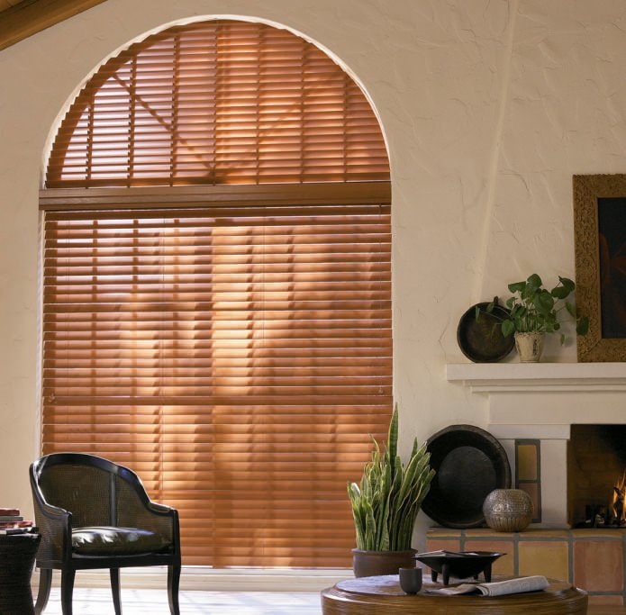 photo of curtains on arched windows: pleated blinds