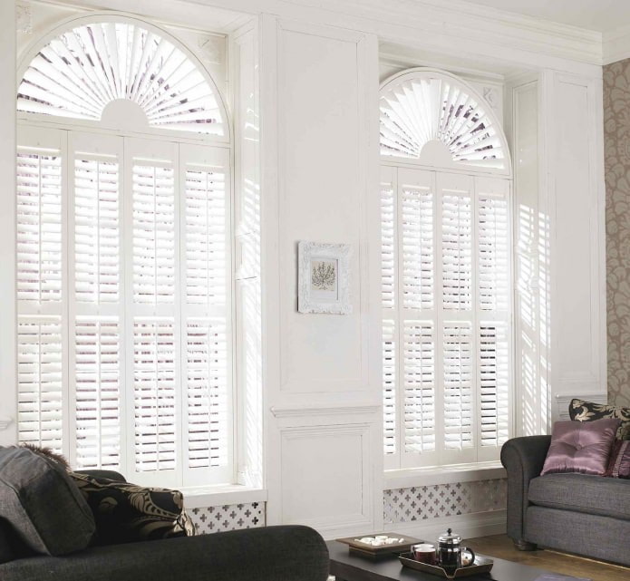 photo of curtains on arched windows: pleated blinds