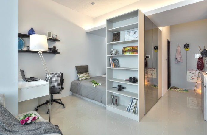 bedroom in the design of a studio apartment of 32 sq. m.