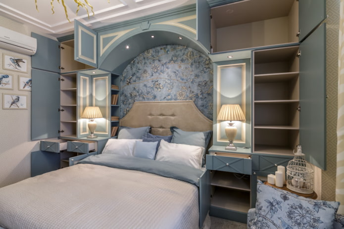 small bedroom with an arch at the headboard