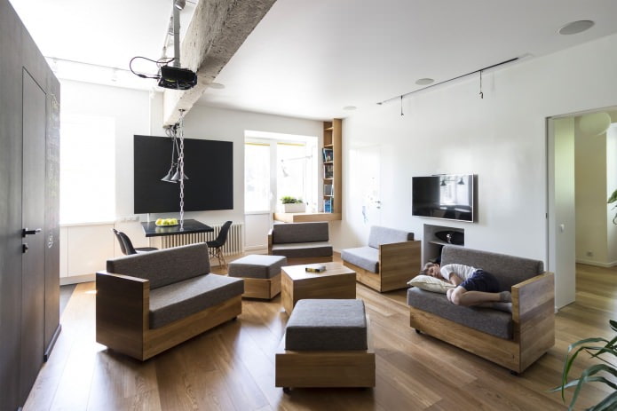 living room in the design of a three-room apartment of 80 sq. m.