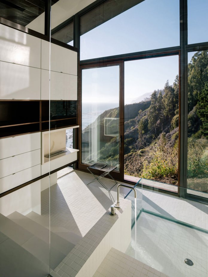 the interior of the bathroom in the house overlooking the ocean