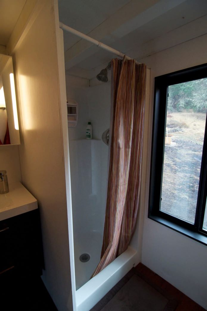 shower in a mobile home wagon with a trailer