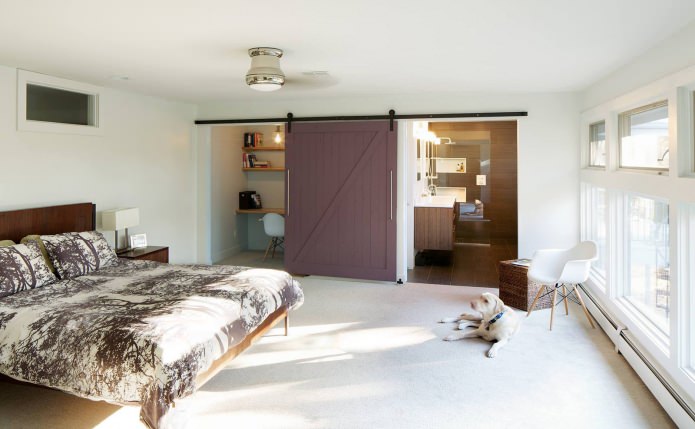 study in the bedroom with a sliding door made of wood