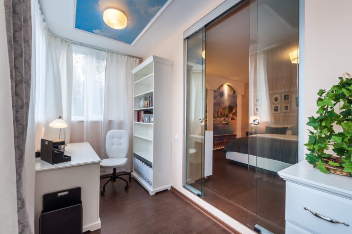 study in the bedroom with a sliding glass door