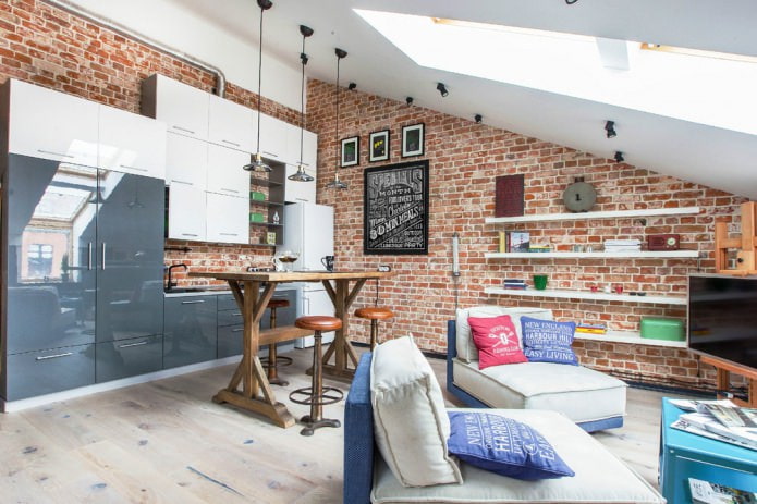 small attic apartment with brick wall