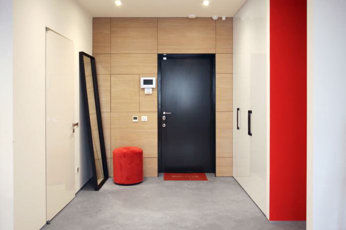 spacious entrance hall with red accents