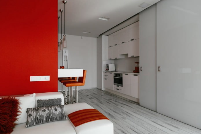 เคาน์เตอร์บาร์ภายในห้องครัว-ห้องนั่งเล่นในโทนสีขาวและสีแดง