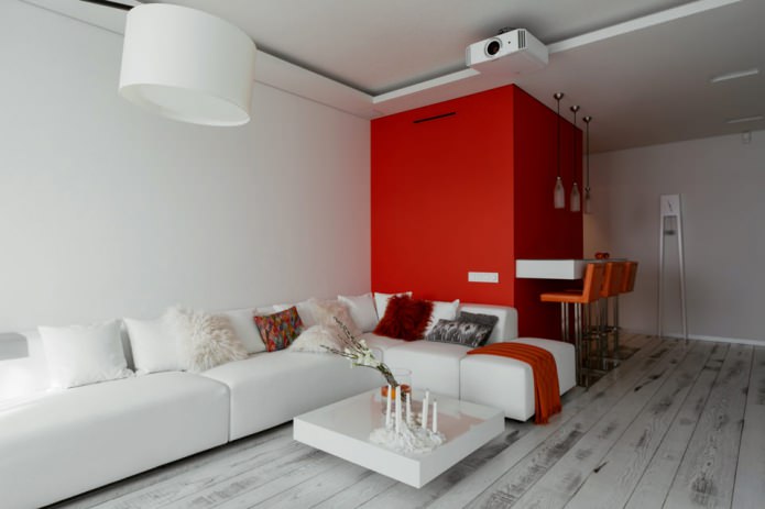 Бар бројач у унутрашњости кухиње-дневне собе у белим и црвеним бојама