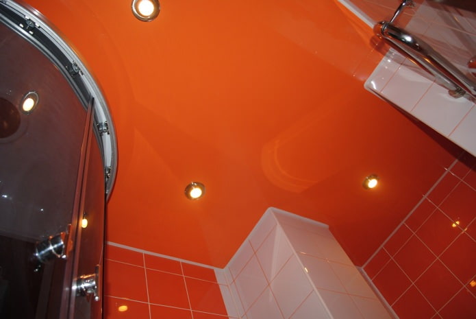stretch ceiling in orange bathroom design