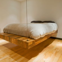 Floating bed in the interior: types, shapes, design, backlit options-1