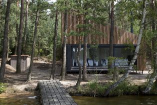 Modern design of a small private house in the forest